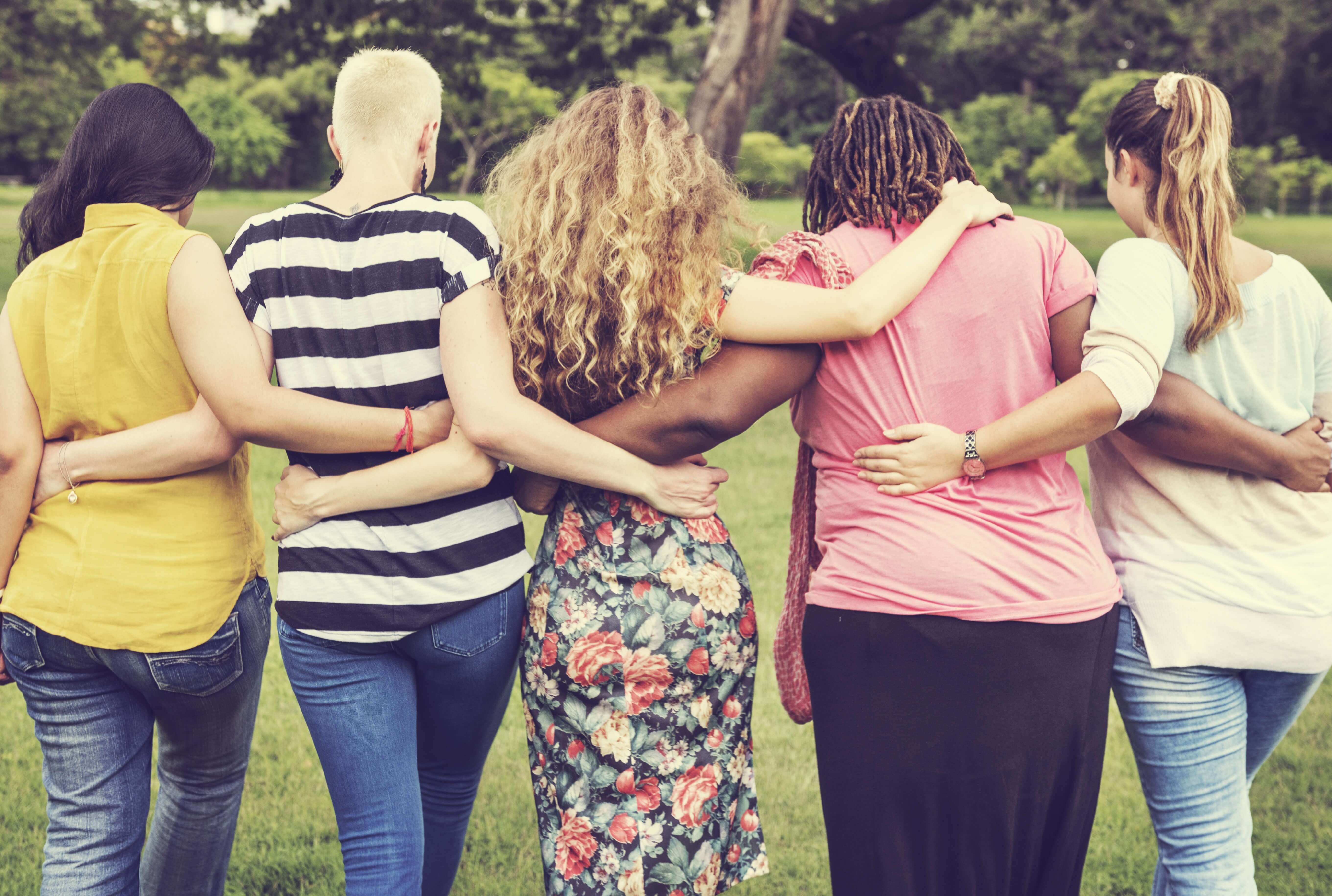 ladies embracing each other around waist
