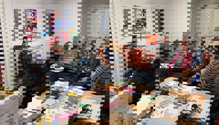 people sitting in a circle in a lounge talking people sitting in a circle in a lounge talking