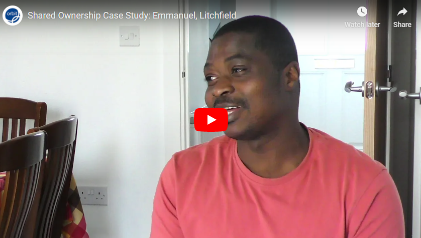 man in peach shirt sitting in a dining room