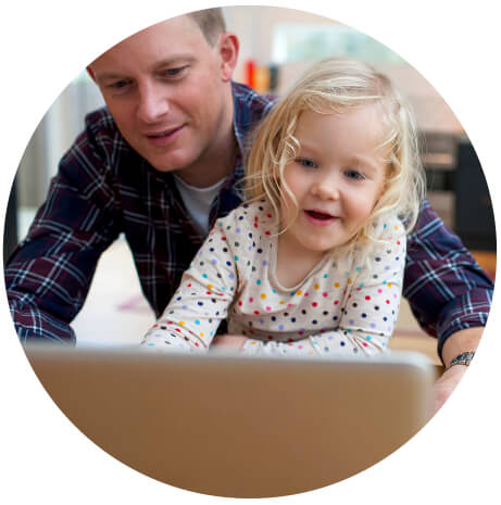 father and daughter looking at a tablet